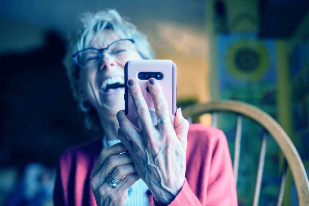 Lady laughing at mobile